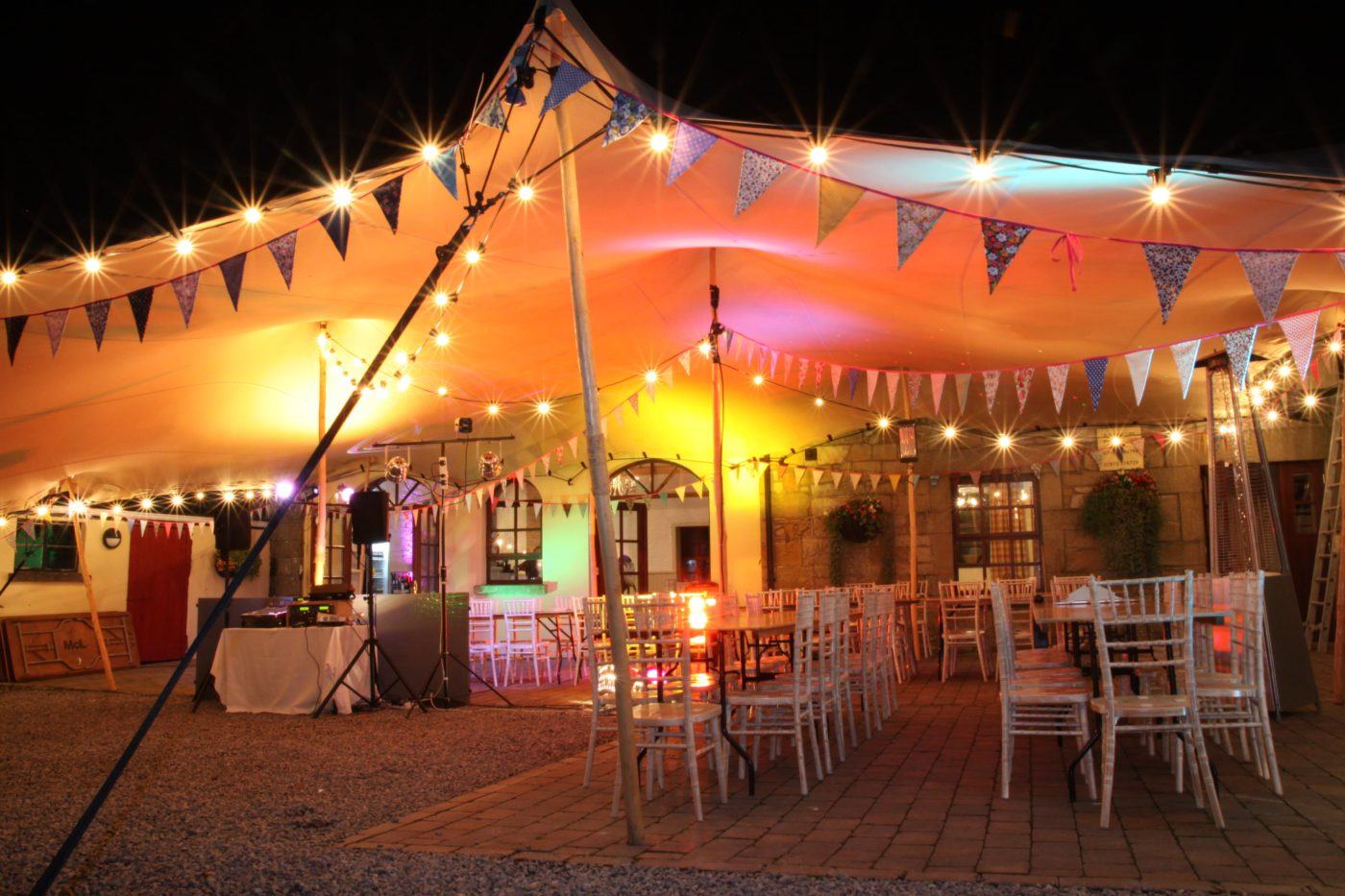 The Coach house with an extended Marquee decorated for a wedding at blessingbourne estate