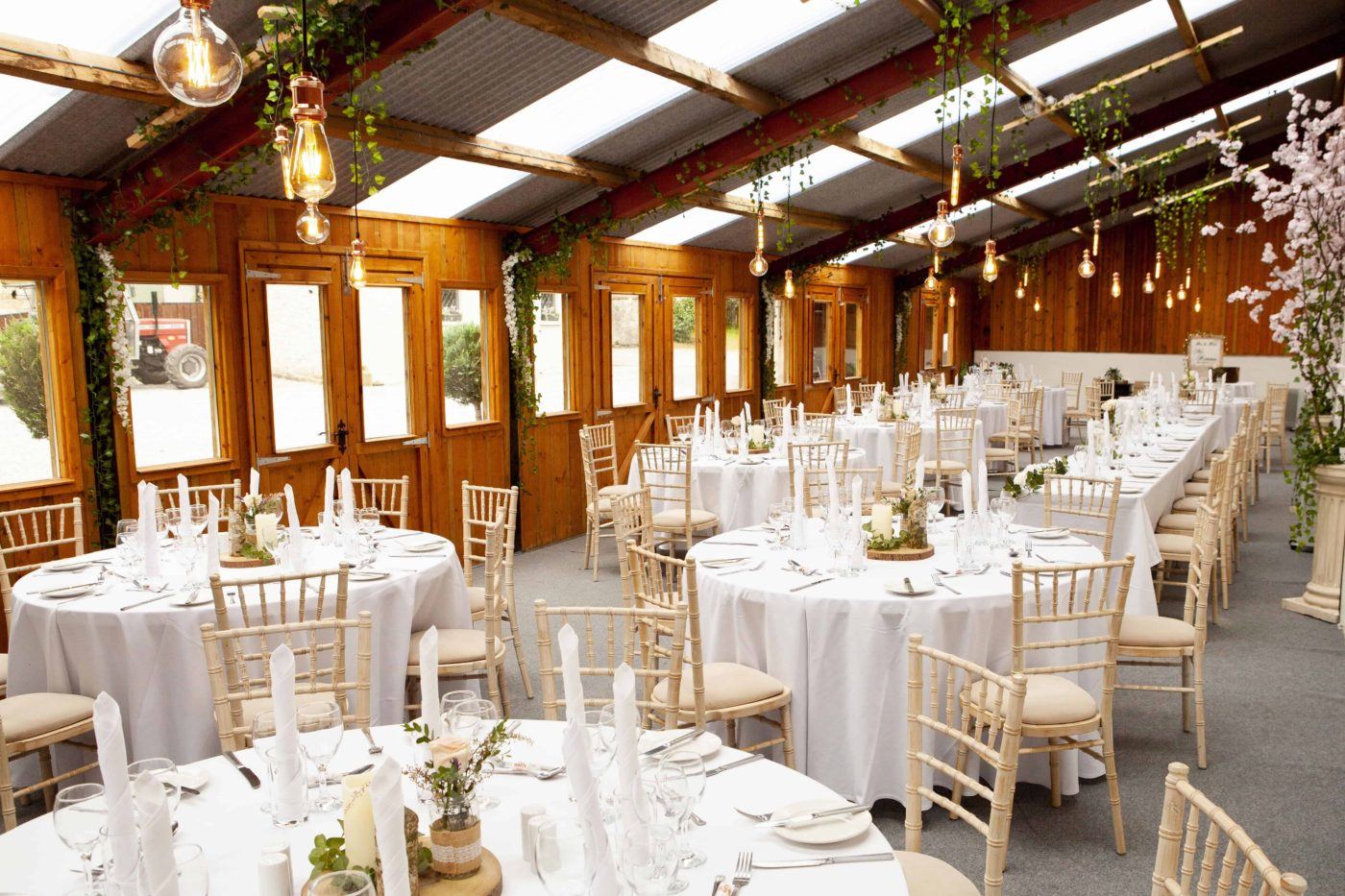 Long Barn decorated for a wedding reception at Blessingbourne estate